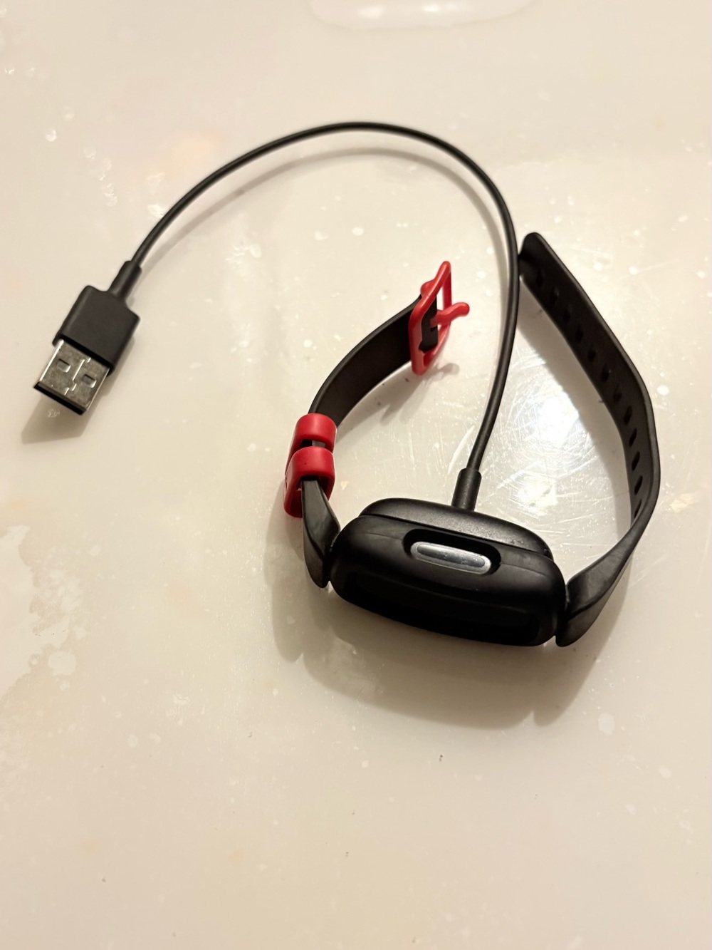 fitbit Black Wristband with Red Buckle and Charger